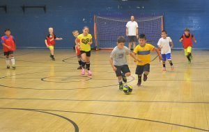 Kids 6-13 playing Futsal indoors - improving soccer skills