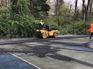Laying down the asphalt for the Tennis Court