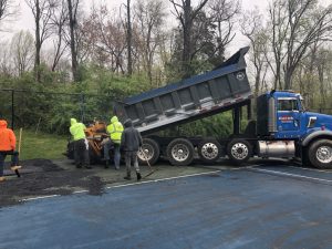 Pouring the asphalt for the Tennis Court